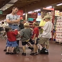 Little Girl At Cashier With Toys