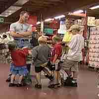 Litle Girl At Cashier With Toys